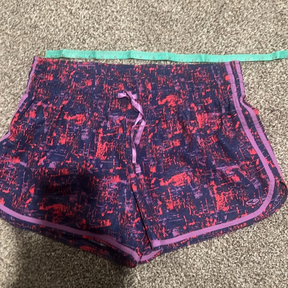 Champion shorts blue, purple and pink.